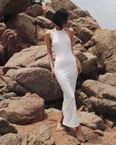 Elegant halter-neck velvet dress with open back and slim silhouette for formal evening occasions